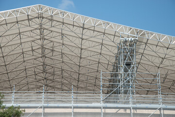 Scaffolding on the roof of a construction site to protect workers from the sun's rays and heat, Rome, Italy.