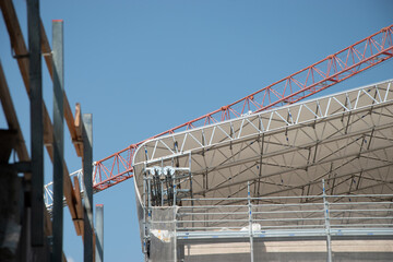 Scaffolding on the roof of a construction site to protect workers from the sun's rays and heat, Rome, Italy.