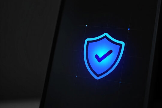 Glowing blue shield with checkmark on dark digital background with grid lines security protection