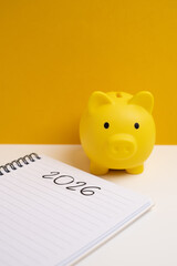 Happy New Year 2026 and piggy bank. Goals, plans, actions, savings, pension fund, investments. Financial concepts