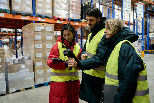 Warehouse workers team scanning inventory in cold storage