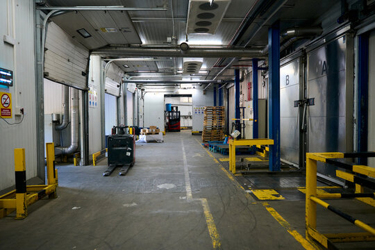 Cold chain warehouse logistics with pallet jack and forklift