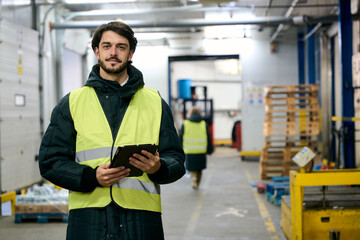 Warehouse worker managing cold chain logistics inventory