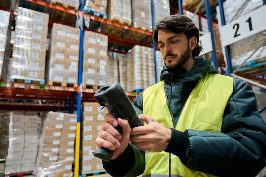 Warehouse worker scanning inventory in cold chain storage