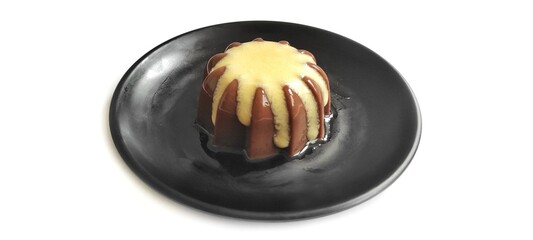 Chocolate Pudding with Creamy Vanilla Sauce  Custard on Black Plate Isolated on White Background. Food Stylish Photography