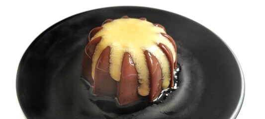 Chocolate Pudding with Creamy Vanilla Sauce  Custard on Black Plate Isolated on White Background. Food Stylish Photography