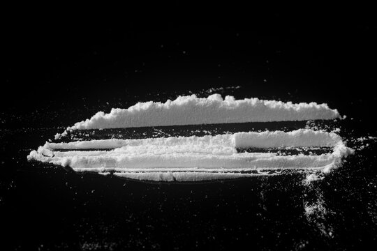 a line of cocaine on a black background