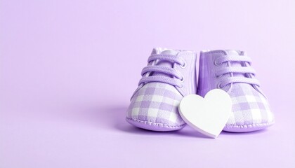 Pastel Purple Baby Shoes and White Heart on Lavender Background for Newborn Announcement or Shower Banner