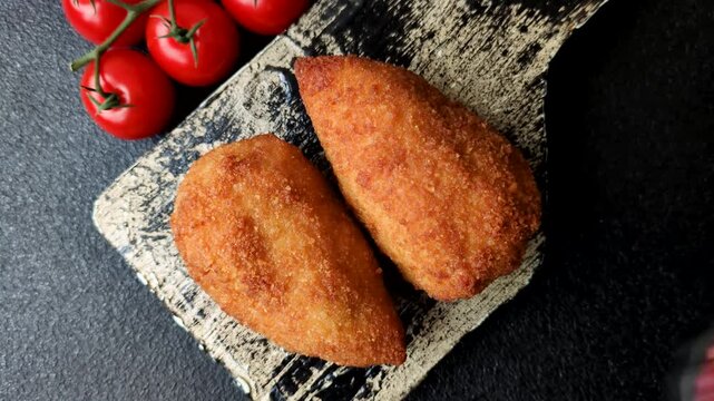 Chicken Kyiv cutlet with buttery filling, a lunch of chicken breast meat. Chicken Kyiv cutlet as a food background for your design