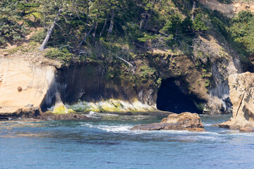 Sea Cave Entrance Carved Into Rugged Coastal Cliff