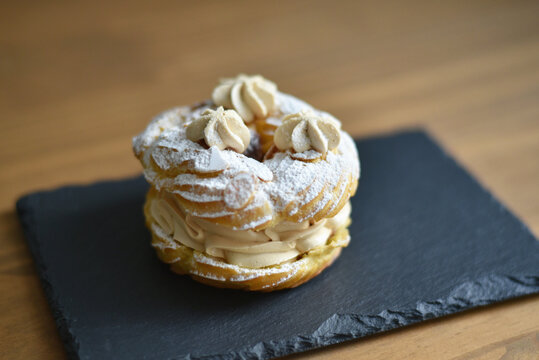 Paris-Brest on black slate board