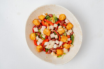 Colorful mix of fresh vegetables, beans, and crunchy toppings creates a delightful salad bowl