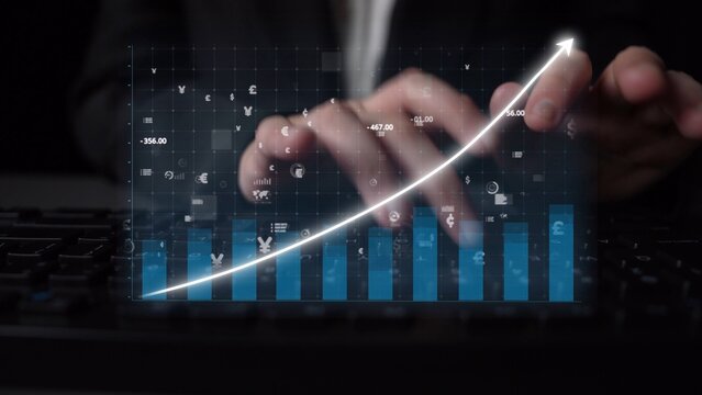 Dynamic image depicting hands typing on a keyboard with a digital financial graph, illustrating growth trends and investment strategies in today stock market. Copula - Powered by Adobe