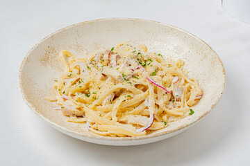 Tasty pasta in a simple bowl topped with herbs and a sprinkle of cheese, perfect for any meal