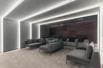 Fototapeta premium This lounge area features contemporary sofas arranged for comfort, accented by ambient lighting along the walls. The stylish decor creates a relaxing atmosphere for social gatherings