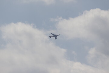 Boeing 747 Departing Through Clouds