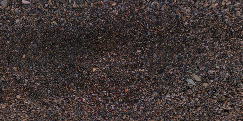 panorama view from above on surface of small pebbles and stones on sea coast