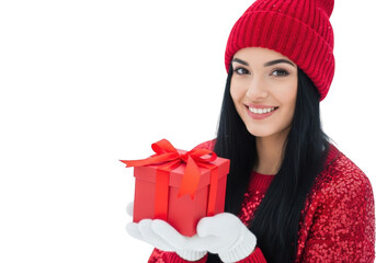 Smiling young woman wearing red knit beanie and sequin sweater holding small red gift box with white glove isolated on transparent background