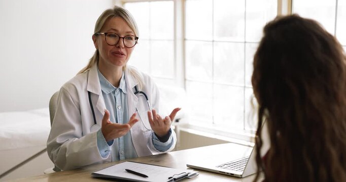 Doctor discussing diagnosis or treatment plan with patient