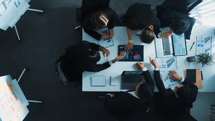 Top view of businesswoman bring financial statistic graph during meeting. Time lapse of smart manager putting tablet with investment data on table while business team brainstorming idea. Directorate.