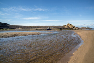 Rivers Neet and Strat flow onto Bude beach Cornwall