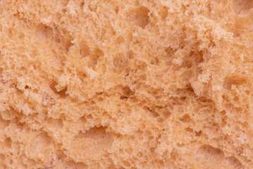 The middle of a cut bread as a background macro photo.