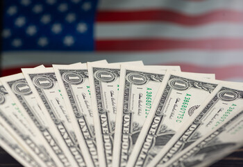 Currency display with American flag background in a close view