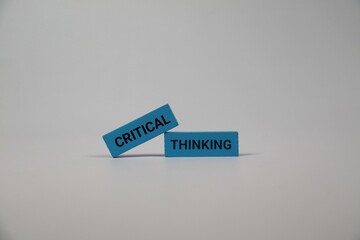 White background highlights blue blocks with the words Critical and Thinking. Perfect for education, business, creativity, and brainstorming themes.