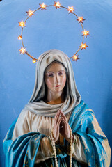 Fototapeta premium Colorful statue (19th century) of Virgin Mary at prayer.