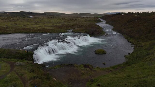 AERIAL Faxi waterfall flowing through green valley
Drone view of Iceland&rsquo;s Faxi waterfall and surrounding nature, captured in 2025.
