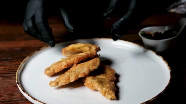 homemade fried fish in batter step by step. step 3 sunflower oil is poured onto a frying pan heated on the stove. High quality 4k footage