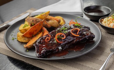 traditional Peruvian food, pork ribs with purple corn juice
