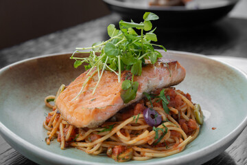traditional Peruvian food, spaghetti alla puttanesca with trout