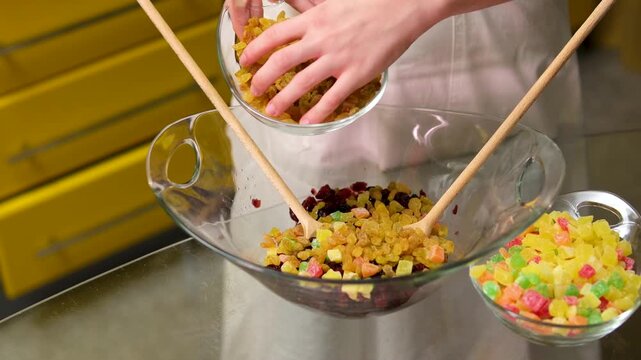 Step by step. Mixing ingredients in a mixing bowl to bake cranberry muffins. High quality 4k footage