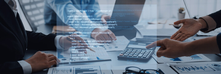 A business team engages in financial data analysis, discussing strategies and charts while utilizing a calculator and modern technology in a professional office environment. Trope