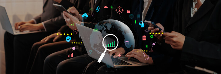 Group of individuals engaging with technology, using laptops and smartphones, surrounded by data visuals, demonstrating modern digital interaction and global connectivity. Trope