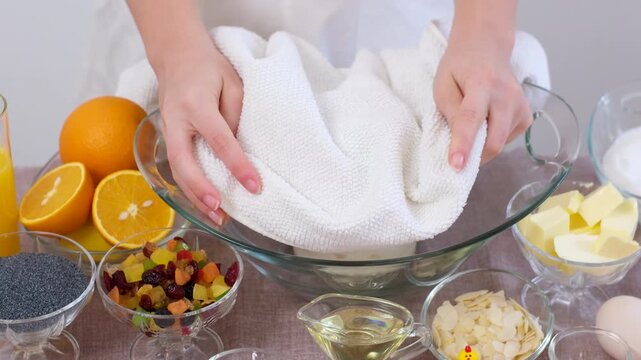 baking for Christmas Easter Making homemade cruffin step by step, rolling yeast dough, spreading butter and poppy seeds, adding dried fruits, baking layered cruffins, cooking process in the kitchen