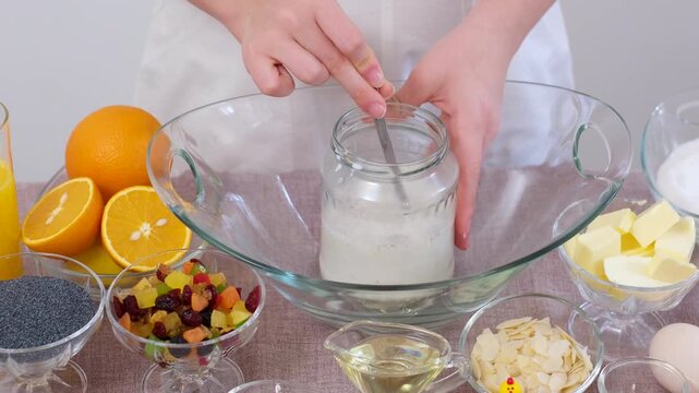 baking for Christmas Easter Making homemade cruffin step by step, rolling yeast dough, spreading butter and poppy seeds, adding dried fruits, baking layered cruffins, cooking process in the kitchen