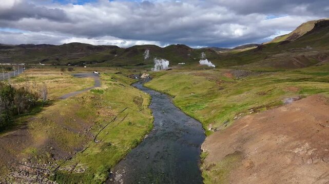 AERIAL geothermal valley and river Iceland
DRONE view of a winding river flowing through a green geothermal valley with steam vents in Iceland, 2025
