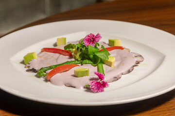 Traditional Peruvian food, octopus with olive sauce