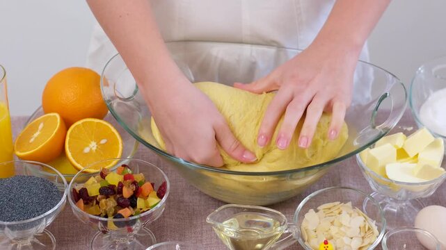 baking for Christmas Easter Making homemade cruffin step by step, rolling yeast dough, spreading butter and poppy seeds, adding dried fruits, baking layered cruffins, cooking process in the kitchen