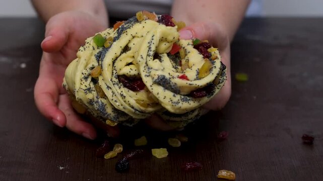 baking for Christmas Easter Making homemade cruffin step by step, rolling yeast dough, spreading butter and poppy seeds, adding dried fruits, baking layered cruffins, cooking process in the kitchen