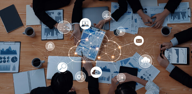 Engaging collaborative meeting scene showcasing professionals using digital devices to analyze data visualizations, enhancing strategy and teamwork in a modern workspace. Trope