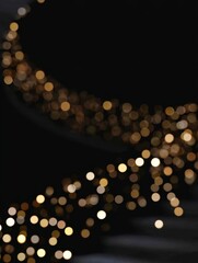 Curved trail of golden bokeh lights on dark background for elegant holiday design, holiday content for luxury branding, advertising, and digital design