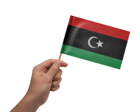 Hand proudly waving the national flag of Libya, celebrating Libyan culture, heritage and independence day with honor