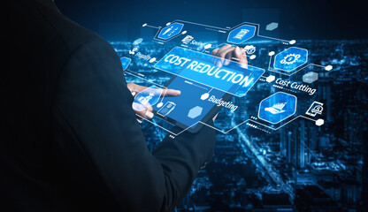 A business professional interacts with a futuristic digital interface showcasing cost reduction strategies against a modern urban backdrop at night. Tessel