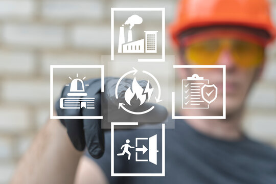 Emergency preparedness plan industry concept. Engineer using virtual touch screen presses the button of fire with lightning symbolizing: emergency plan. Checklist to do in disaster.