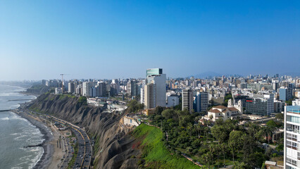 Sunny afternoon in the coastal district of Miraflores with views of Larcomar from a drone.