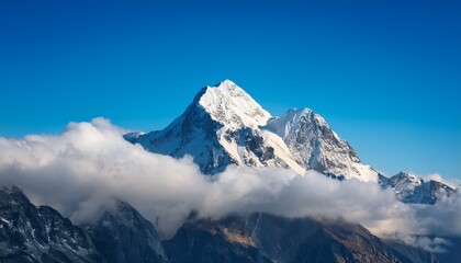 A Majestic Mountain Peak Emerging From The Clouds Symbolizing Achievement And Serenity With A Vibrant Blue Sky