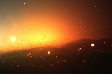 Sunset Over Silhouette Landscape With Glowing Particles and Bokeh Effect